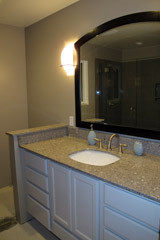 Installed Countertop and New Mirror (see the shower in the reflection?)